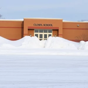 Closed school building covered in snow during winter